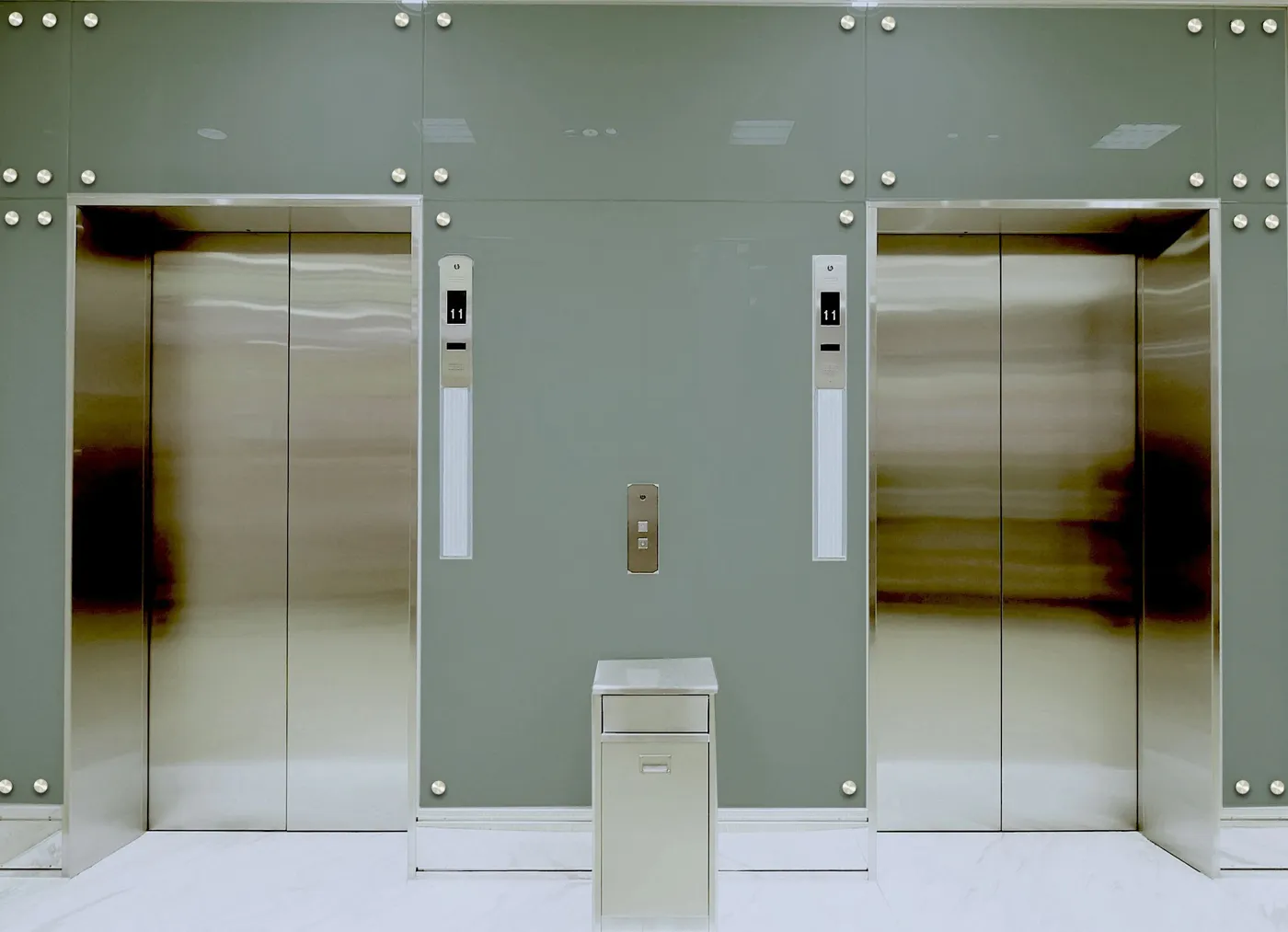 Stainless elevator entrances in a modern lobby